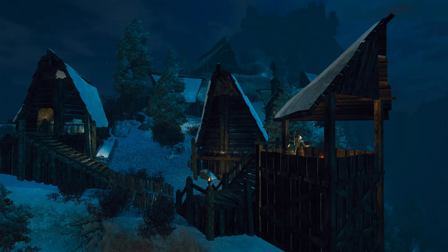 Gothic 3 Classic: śnieżna osada w Nordmarze nocą, drewniane chaty i palisada